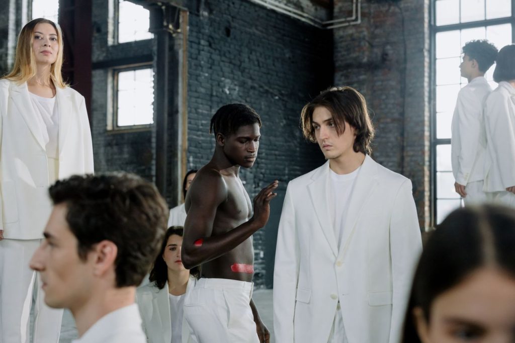 The Art of Drawing Readers In: Your attractive post title goes here Models in a fashion shoot wearing white outfits in an industrial space.